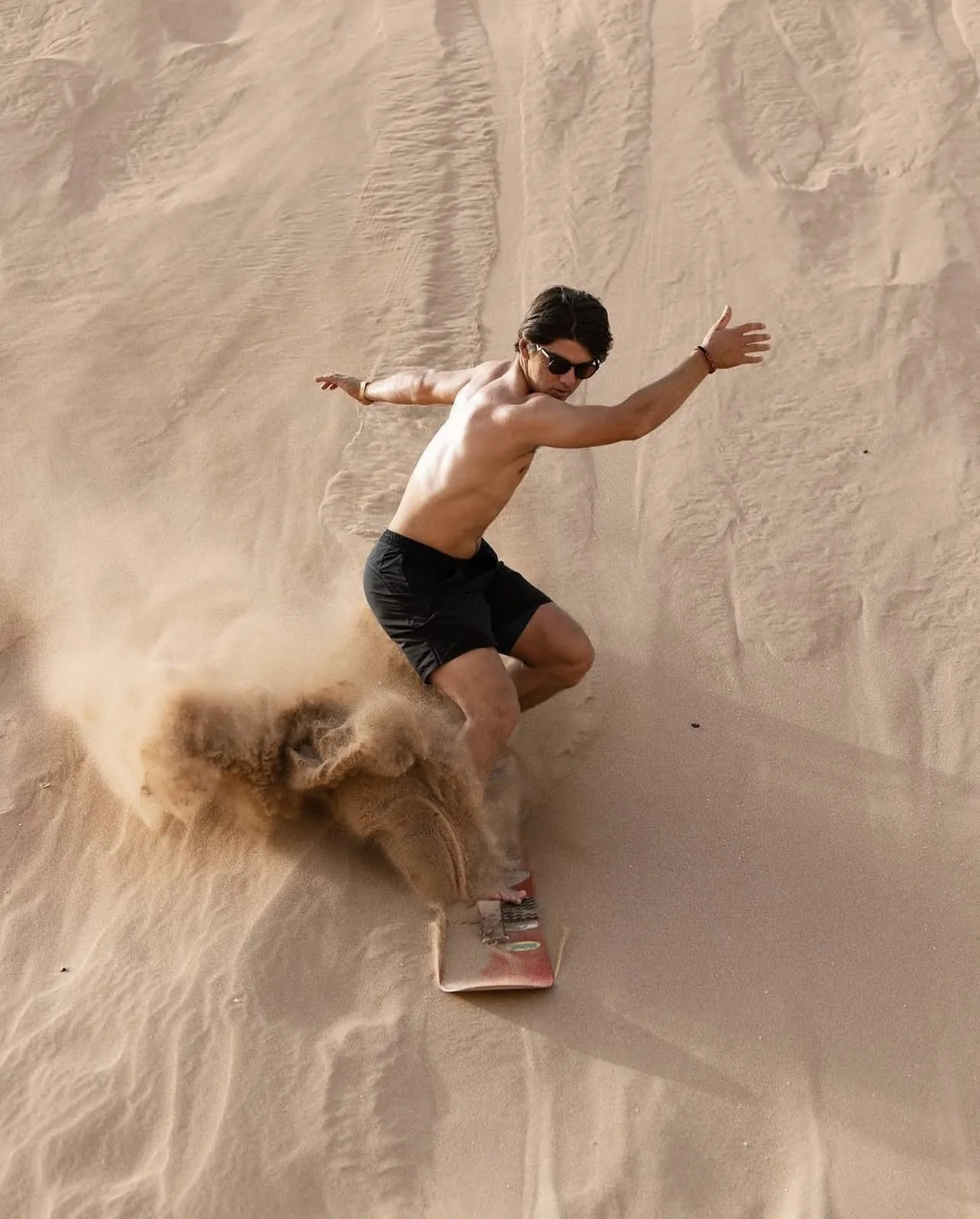 Sandboarding on dunes near Agadir Morocco