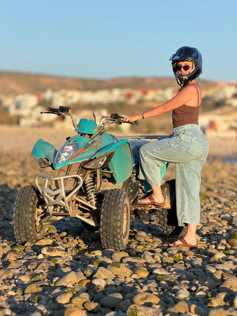 Happy couple with quad bikes beside the Atlantic coast