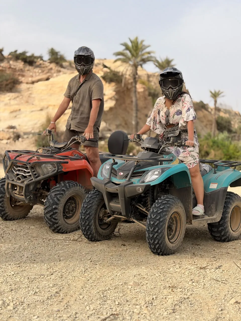 Quad bike rider beside a dramatic mountain cliff near Agadir